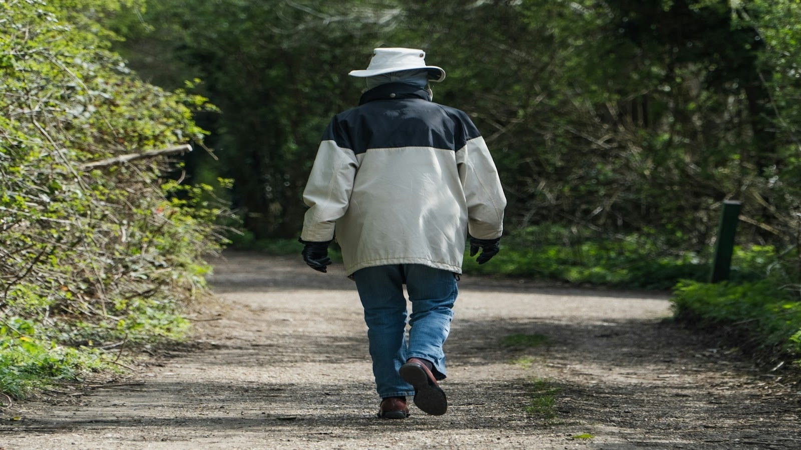 adult walking peacefully outdoors