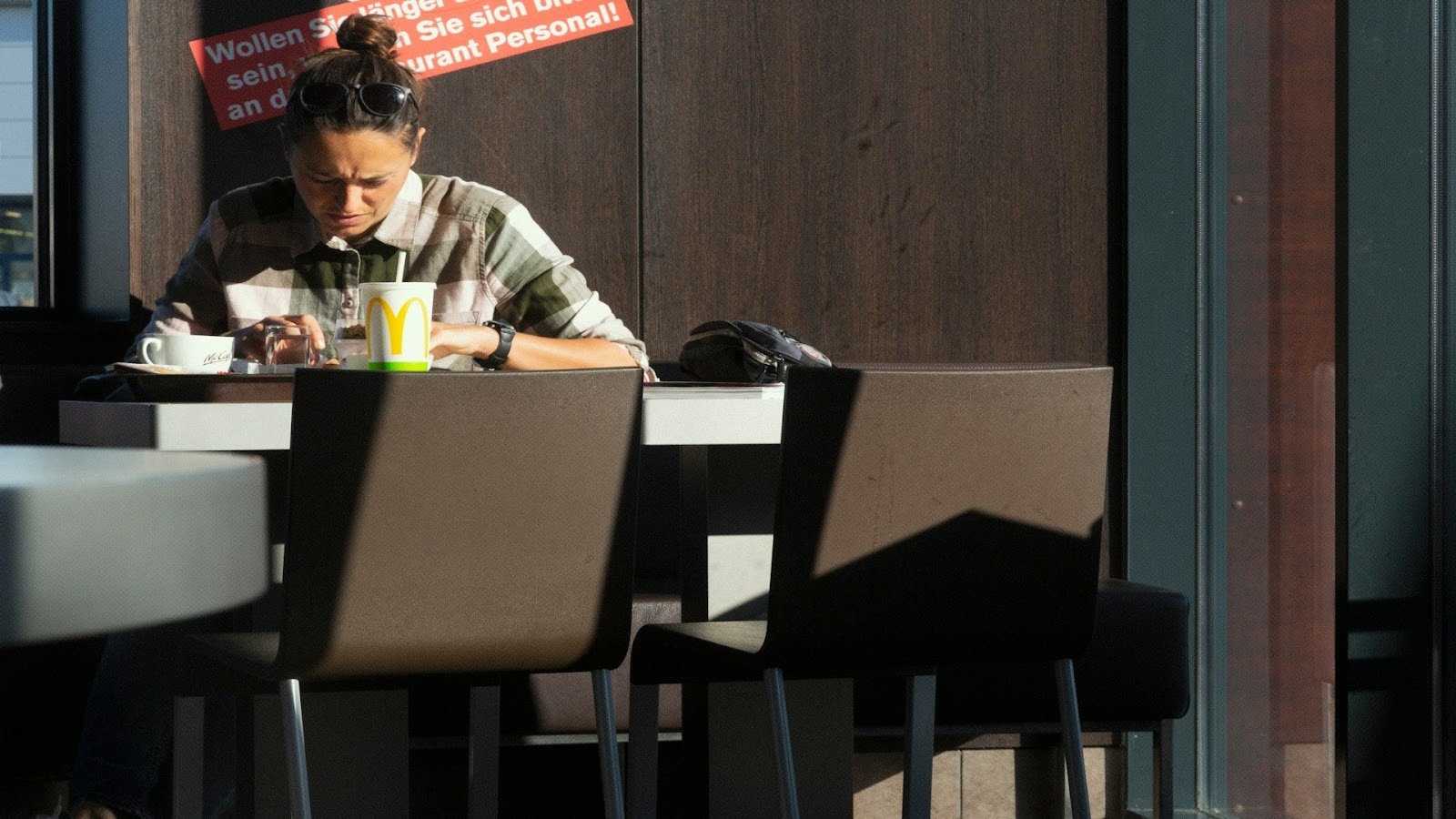 man sitting alone reviewing bills