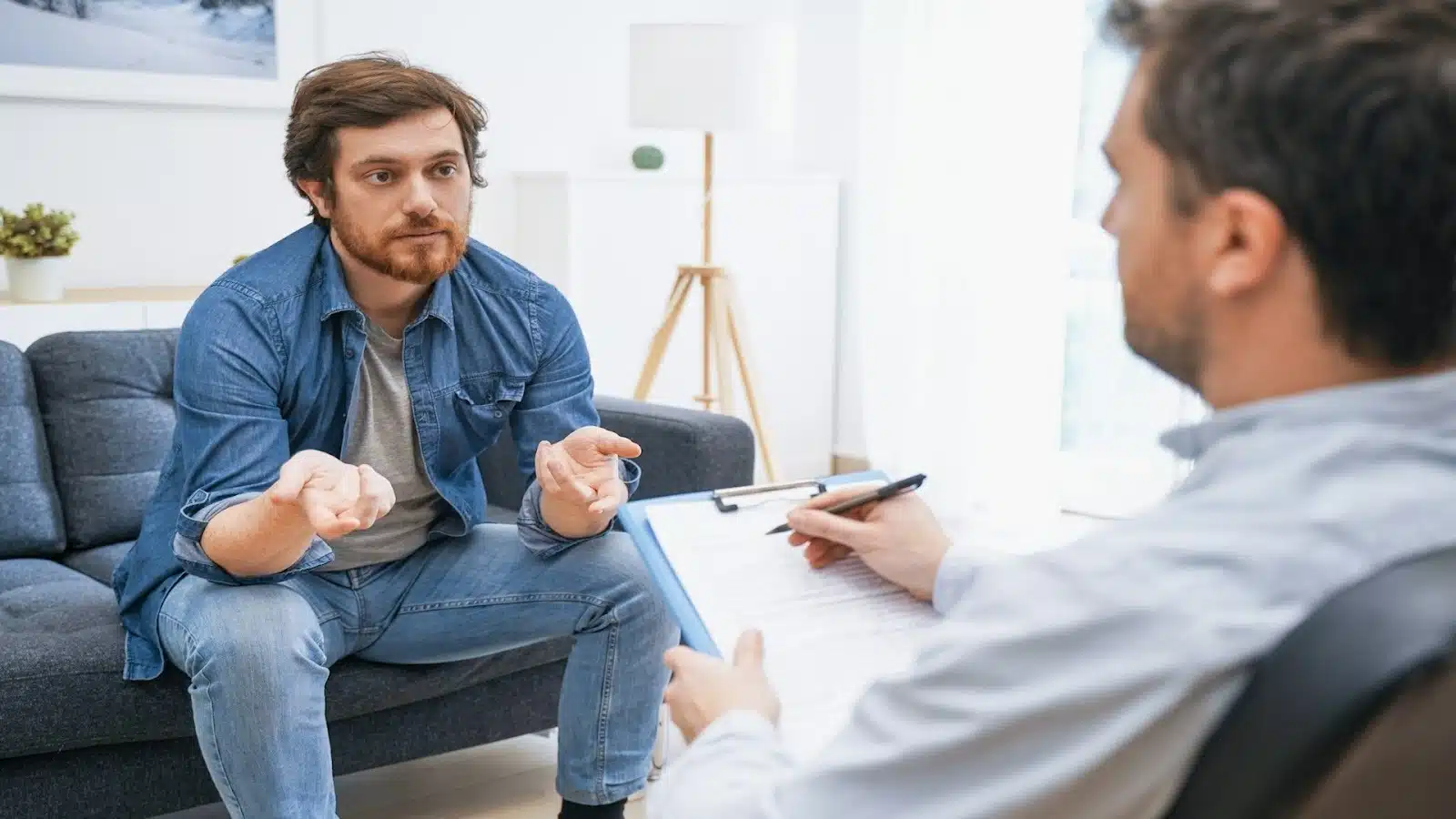 man speaking seriously during conversation