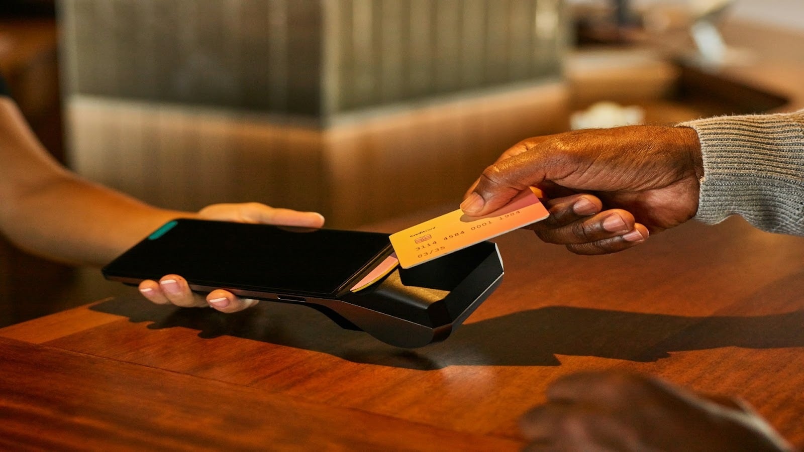 man paying bill at restaurant