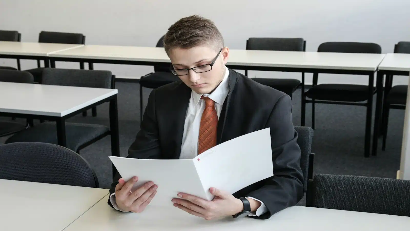 man reviewing documents thoughtfully