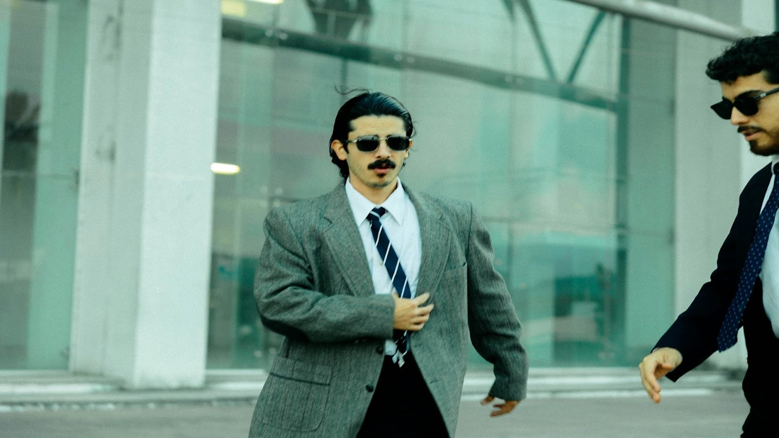 man walking confidently outdoors