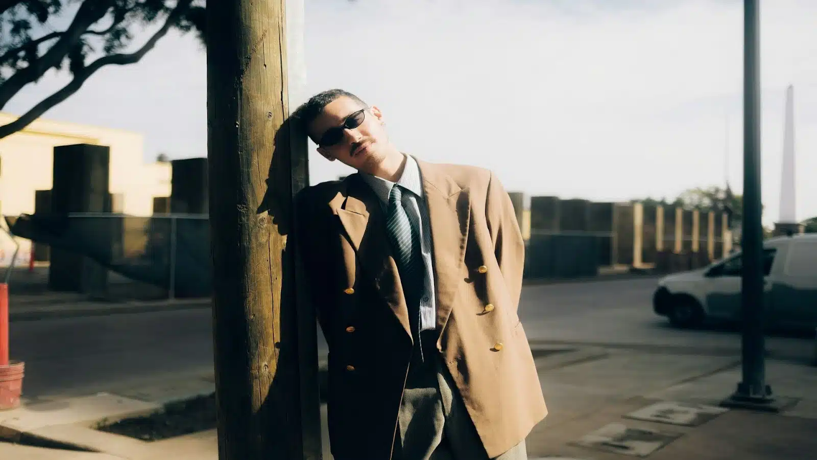 man standing confidently in sunlight