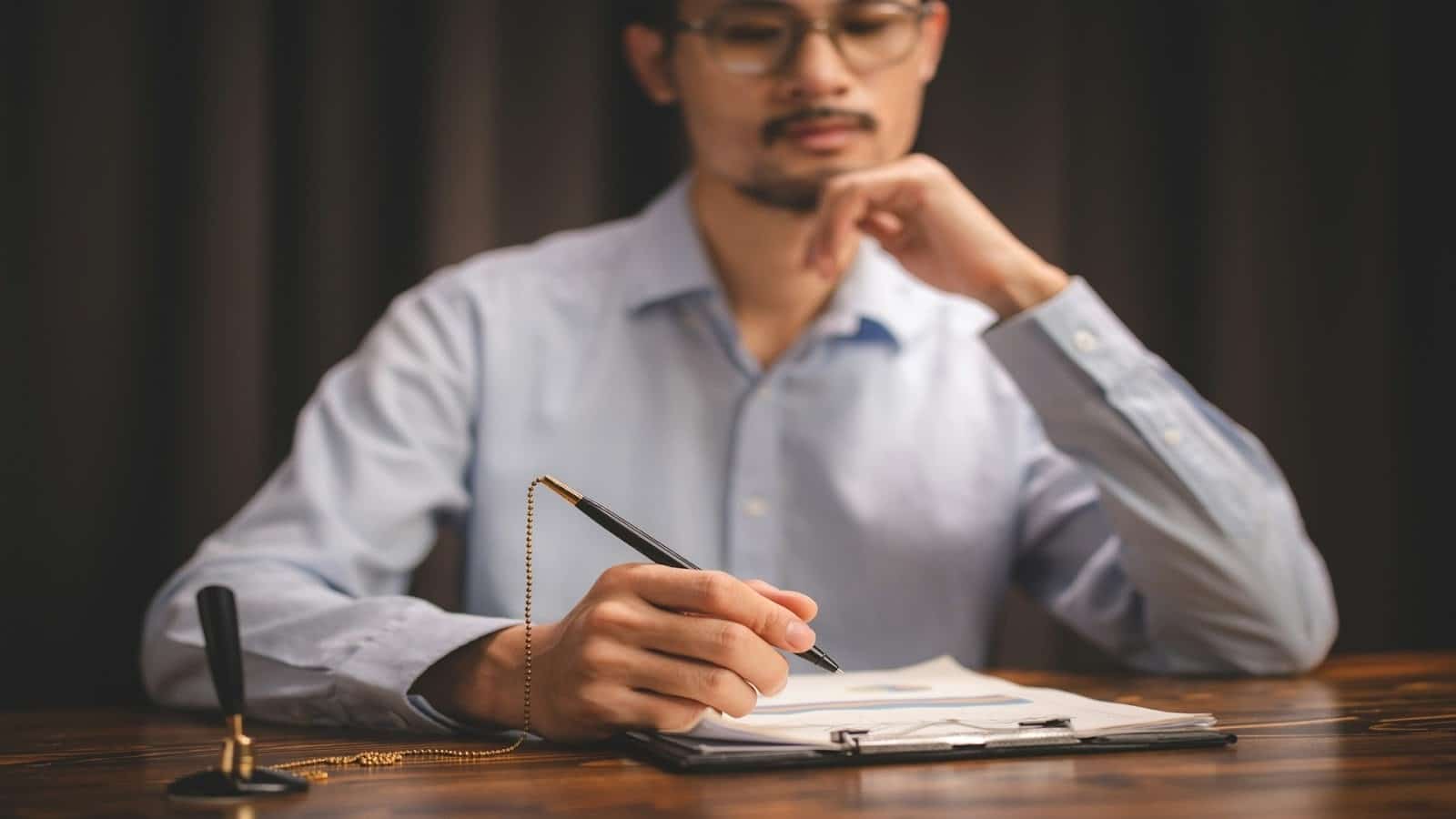 man reviewing plans with determination