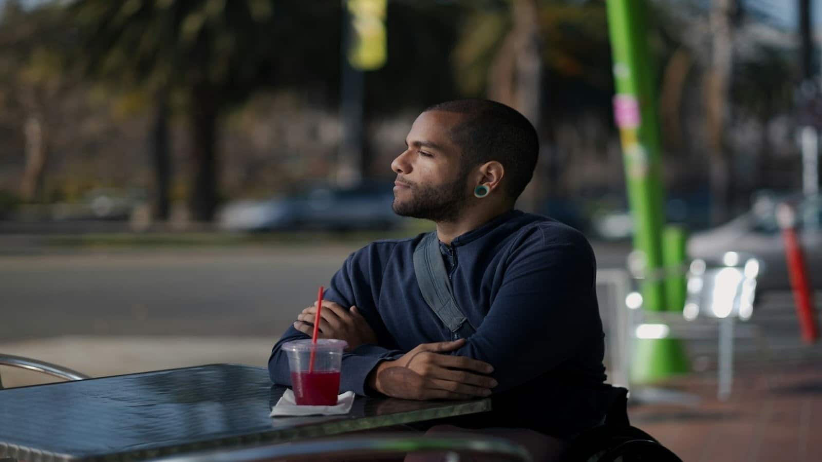 man sitting calmly outdoors