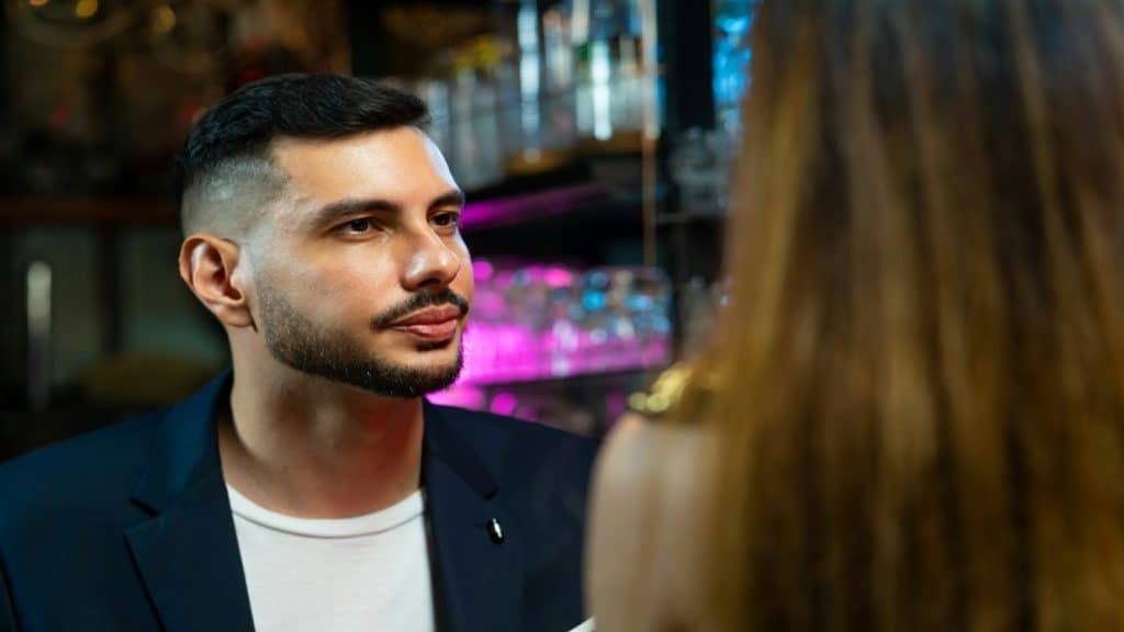 man looking serious during conversation