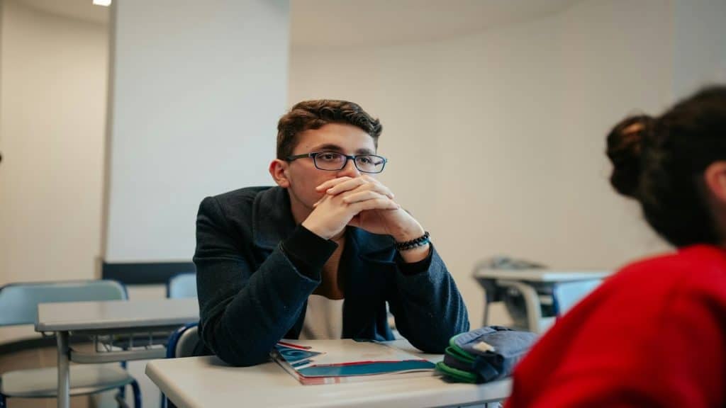 man looking thoughtful during discussion