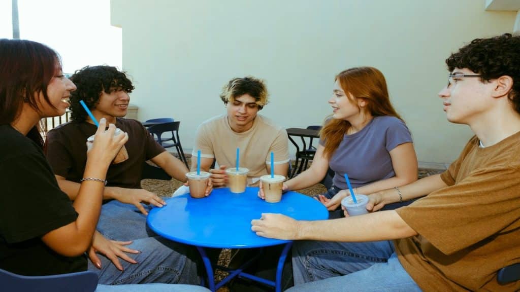 friends sitting together at table