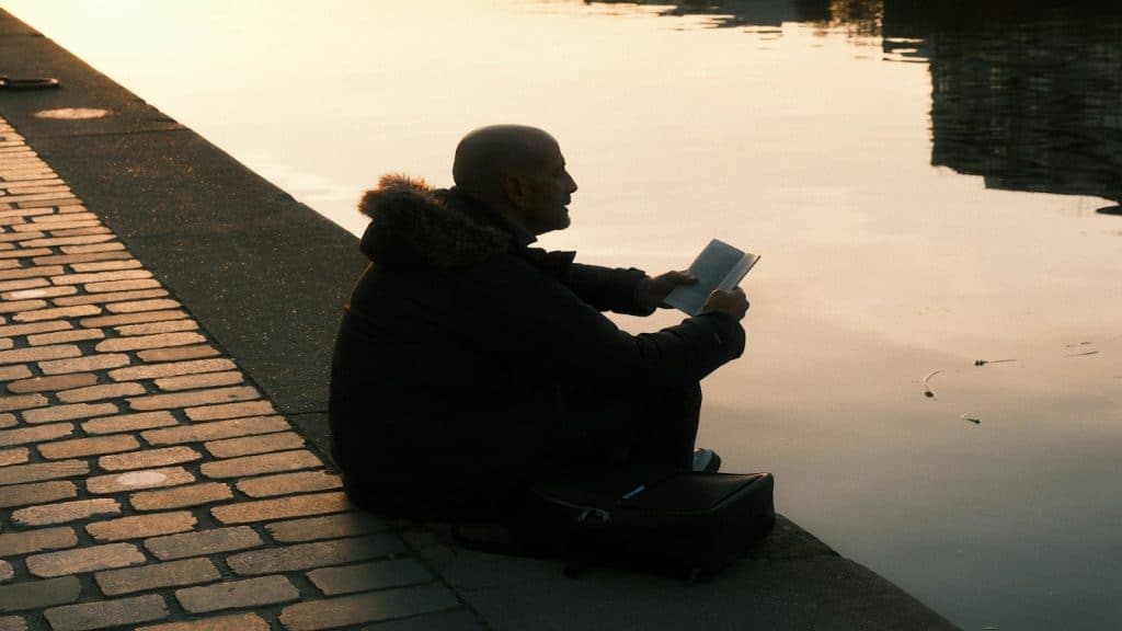 man reflecting quietly outdoors