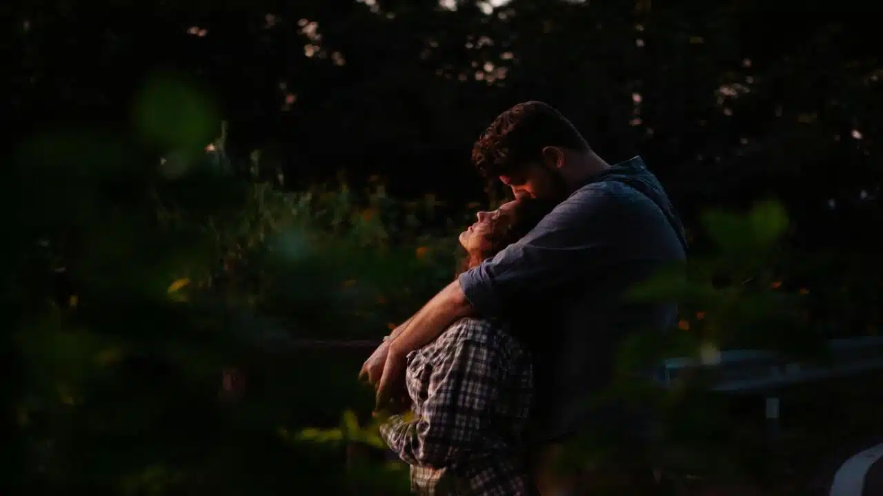 A couple hugging at sunset