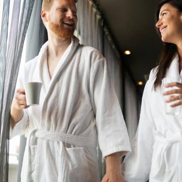 A couple in white bathrobes