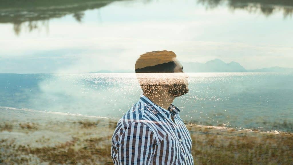 man looking reflective outdoors