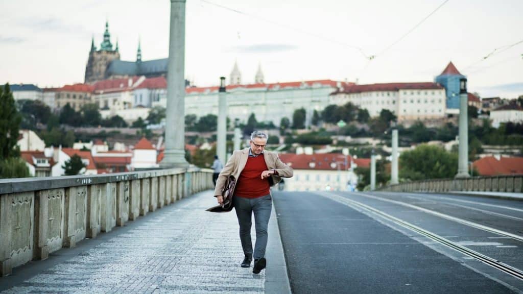 man walking confidently in city