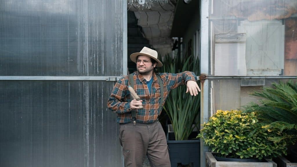 man standing confidently outdoors