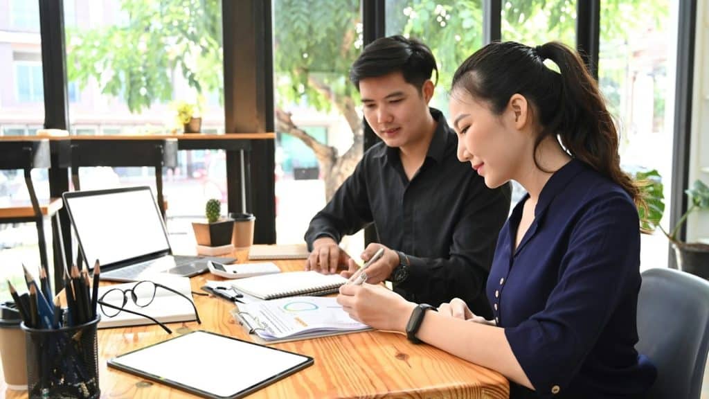 couple reviewing documents at table