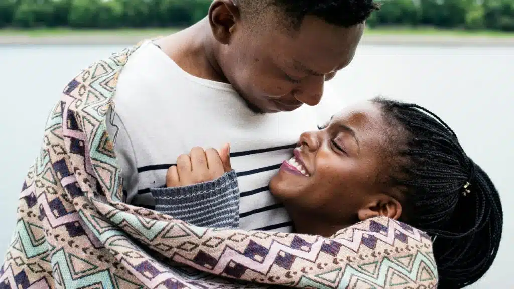 A couple wrapped in a blanket
