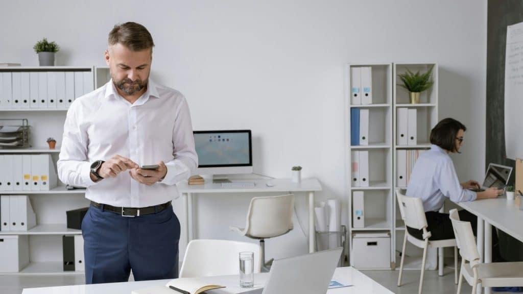 A man busy working and not talking to his partner
