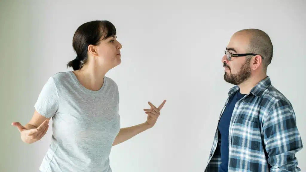 A woman annoyed and a man looking at her