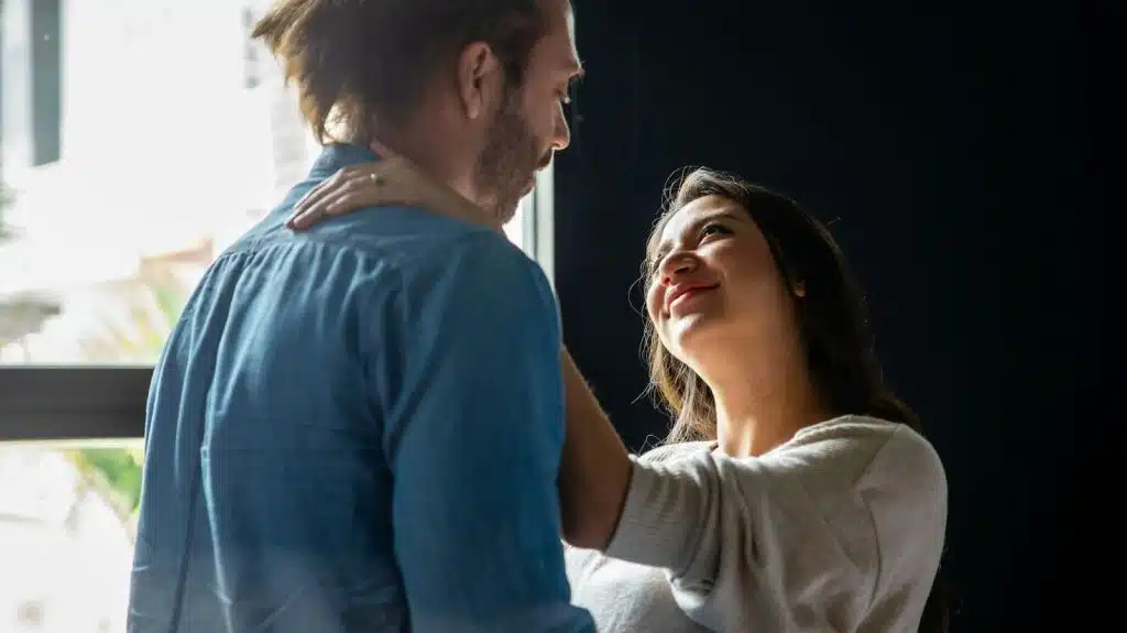 A man and woman looking at each other