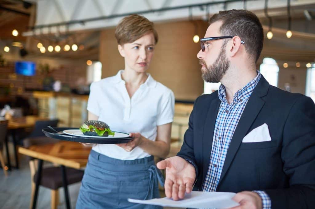 A man being rude to servicer worker