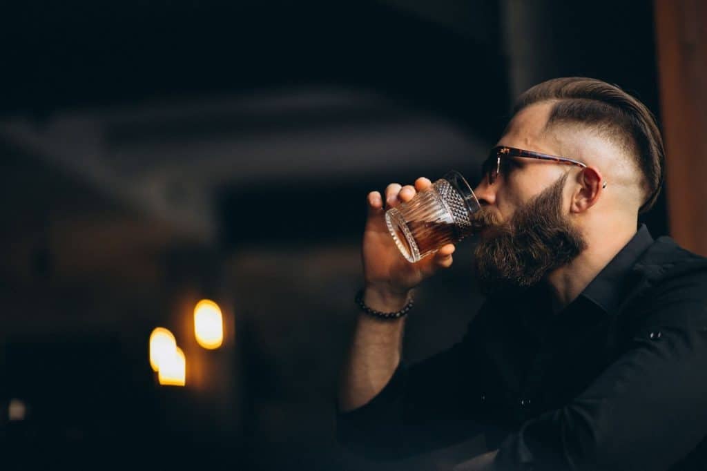 A man drinking alcohol