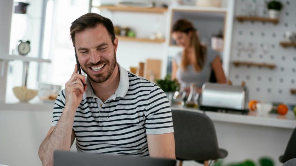 A man talking with someone over the phone
