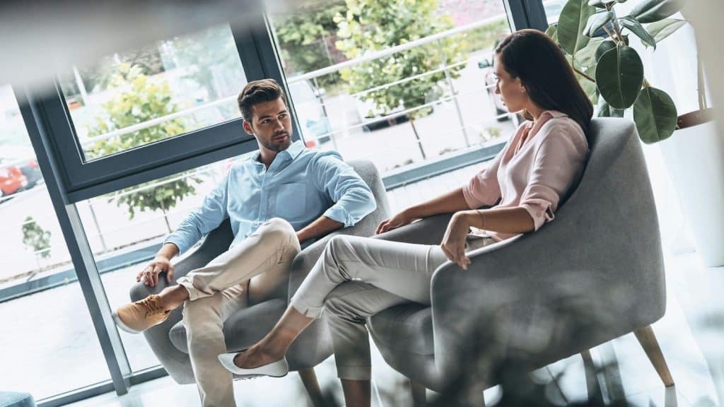 A man and woman talking