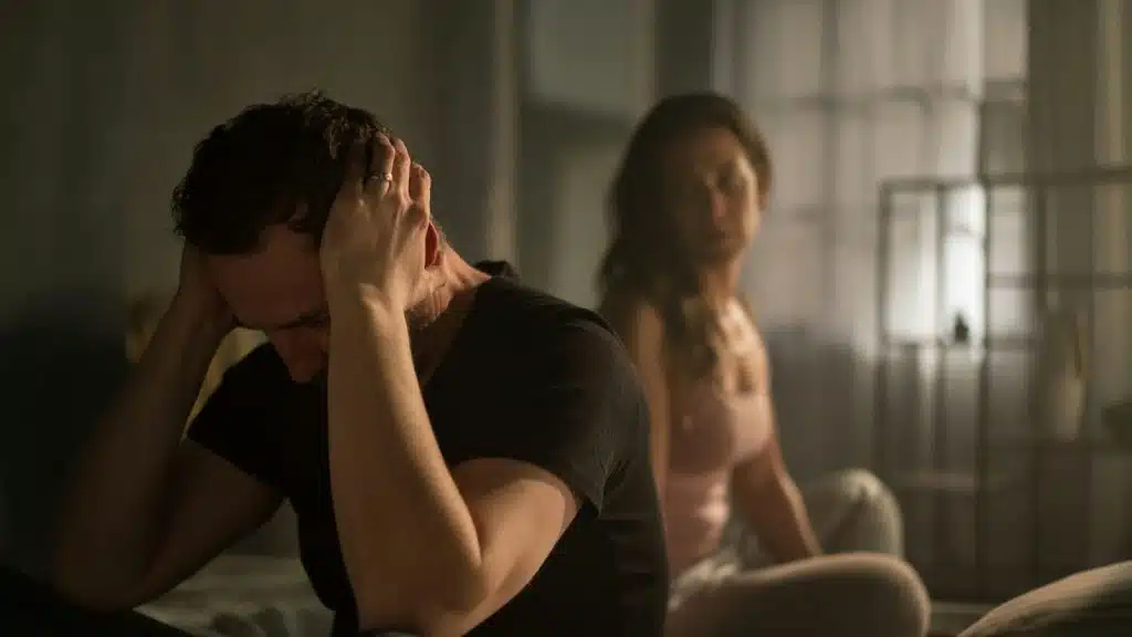 A man covering his ears