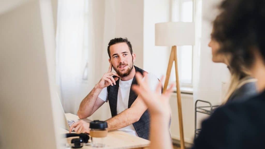 A man listening to woman