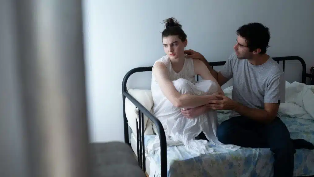 A man trying to speak with woman