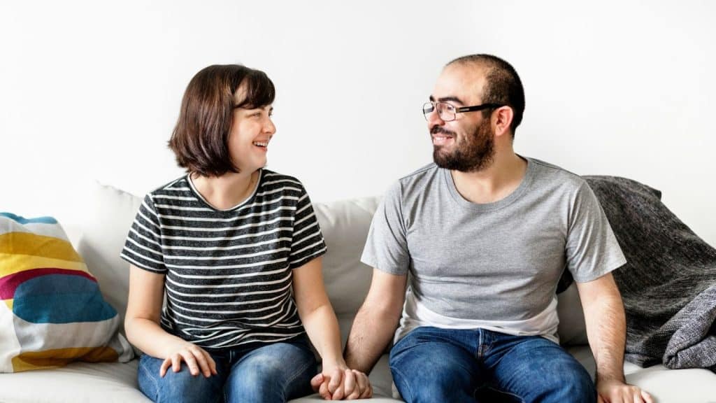 A man and woman holding hands