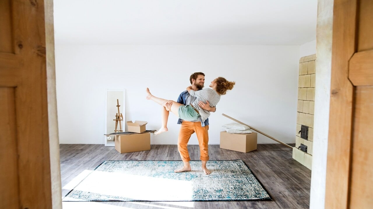 A couple excited at home