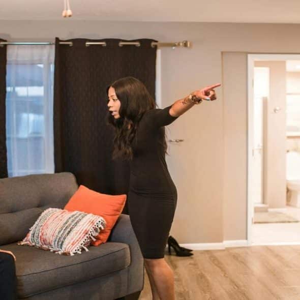 A couple arguing in the living room