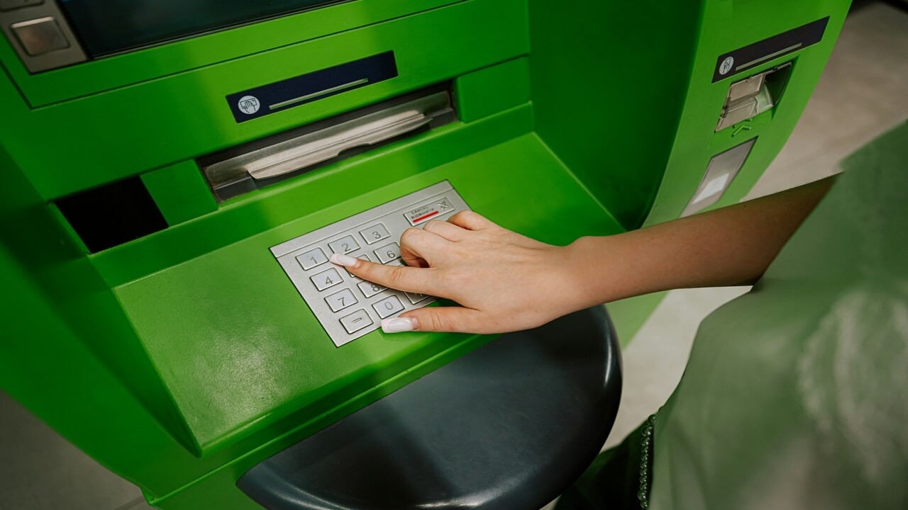 A woman using an ATM