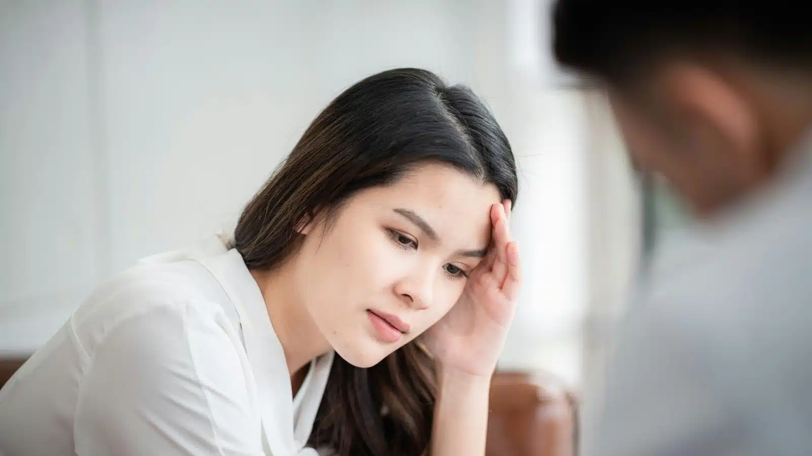 Woman holding her head