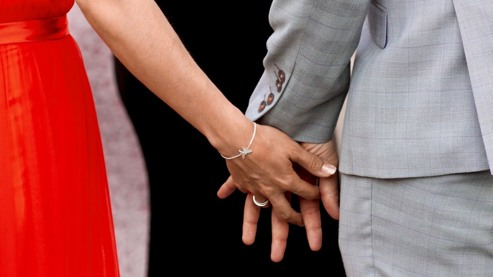 couple holding hands closely
