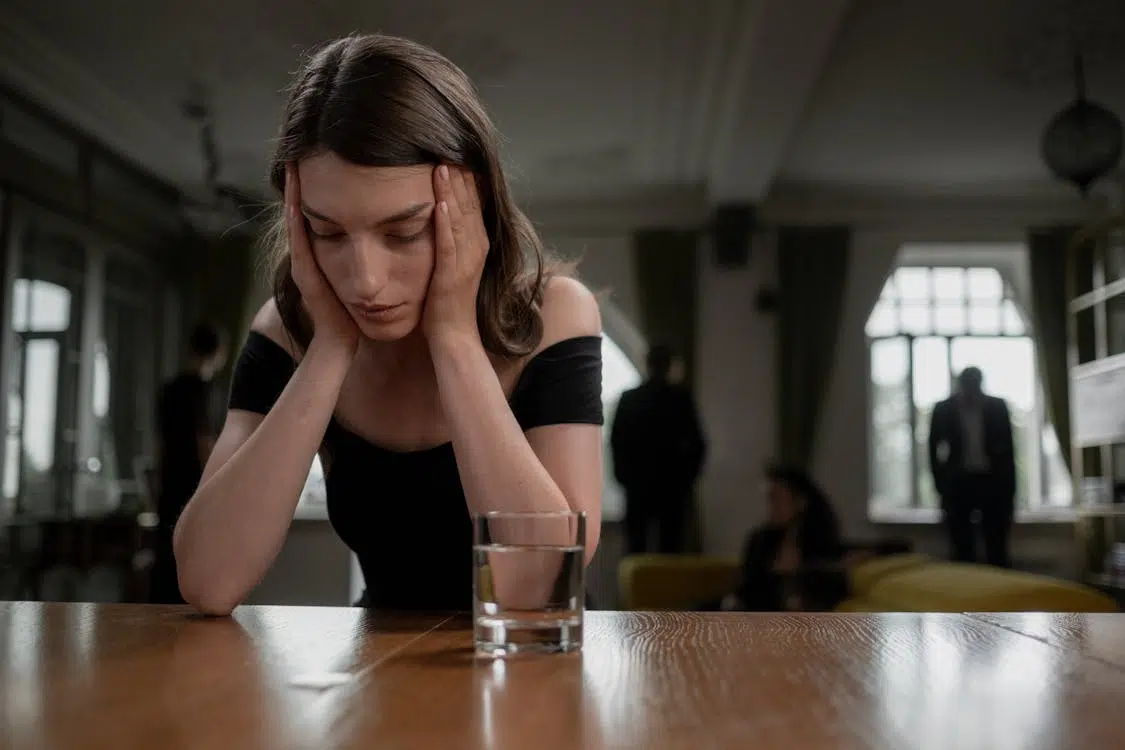 Woman Crying on a Wooden Table