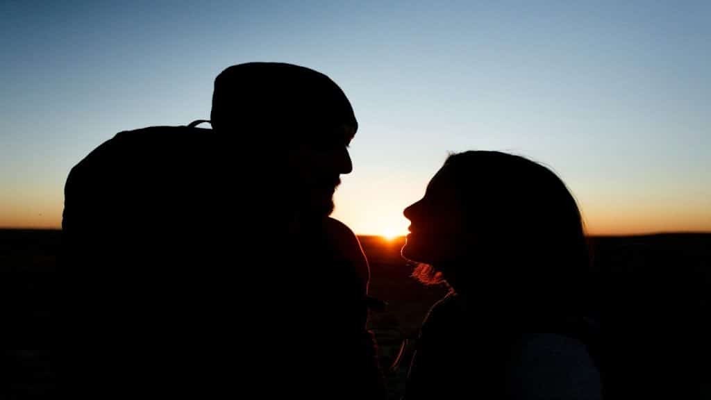 couple standing together at sunset