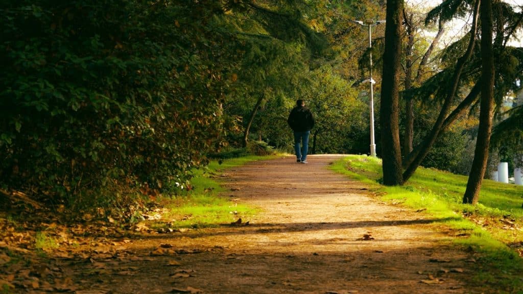 individual walking alone outdoors