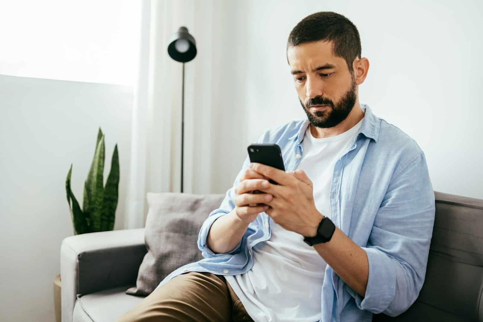 man looking at phone
