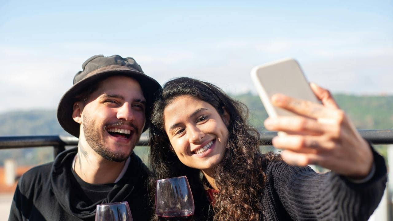 A smiling couple taking a selfie