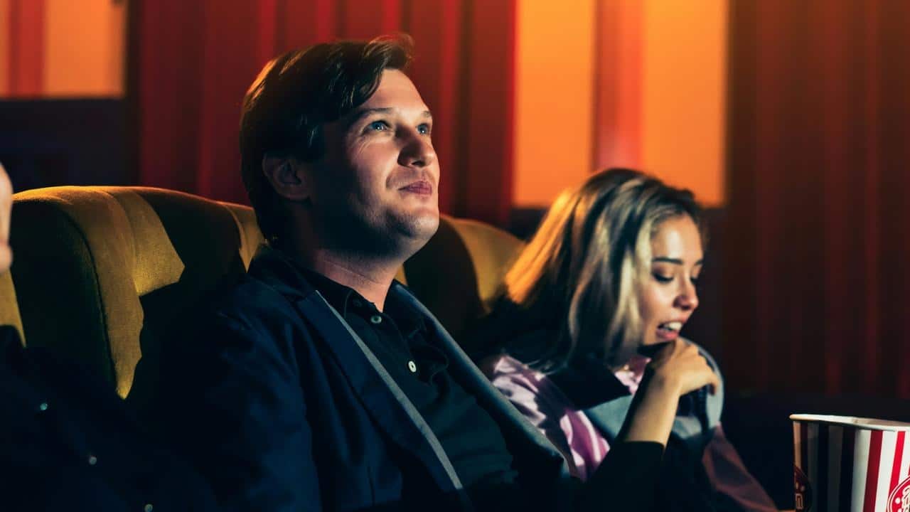 A couple sitting in a movie theater
