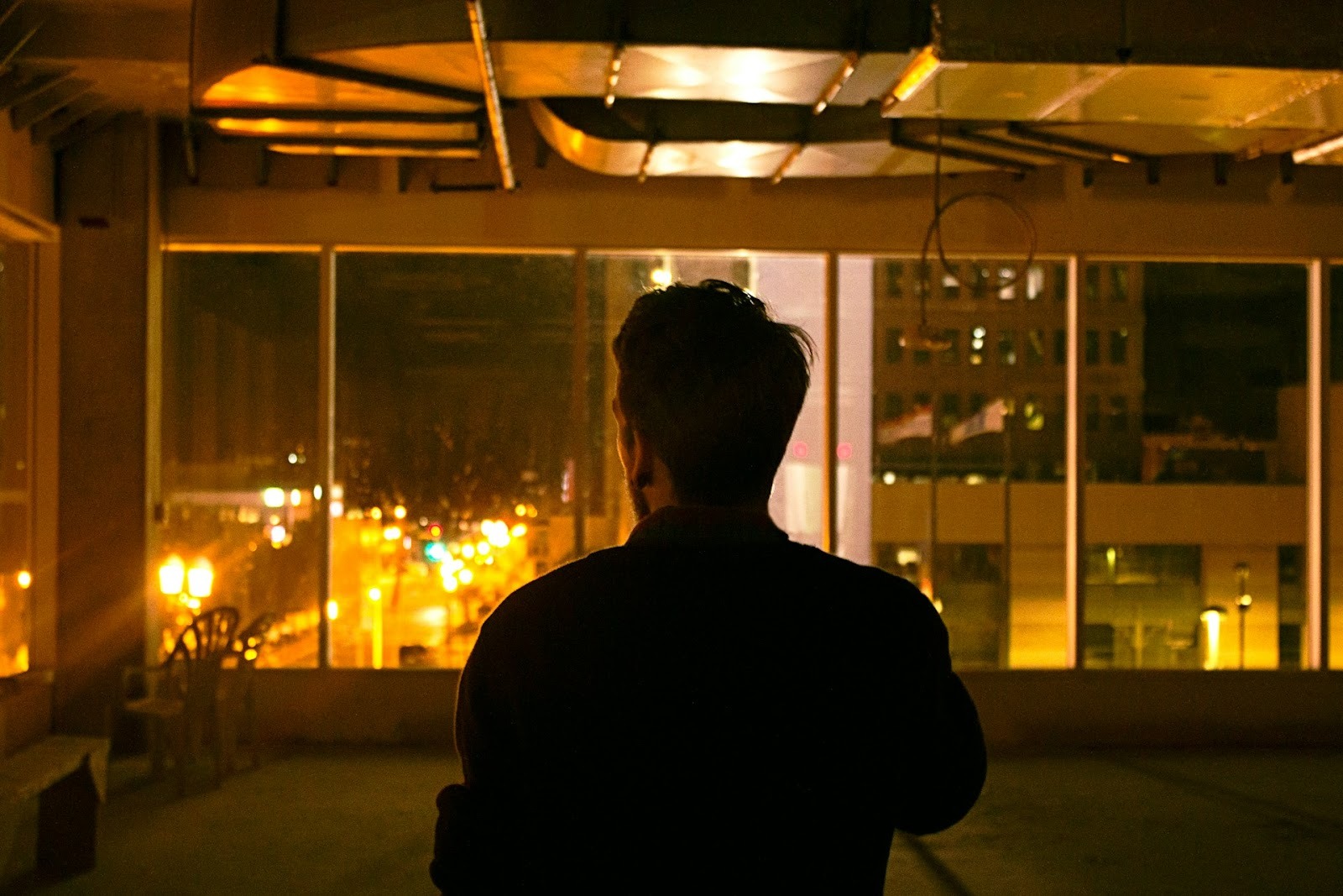 man alone city night