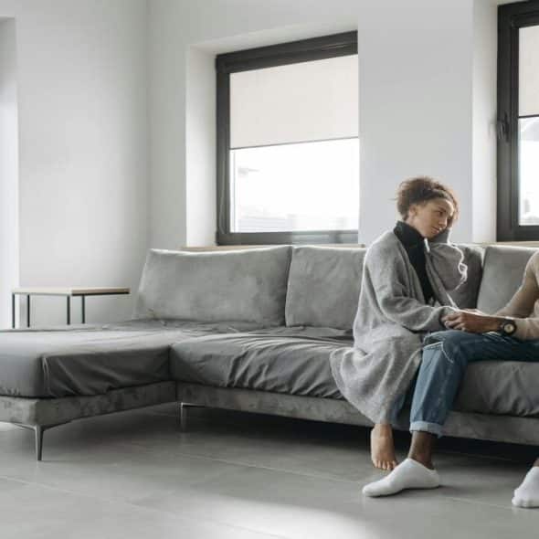 A couple talking in the living room