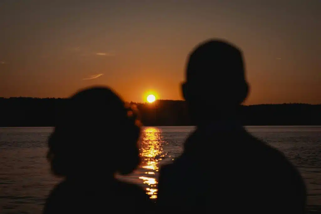 couple reflective sunset