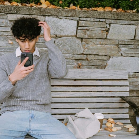 man using smartphone alone