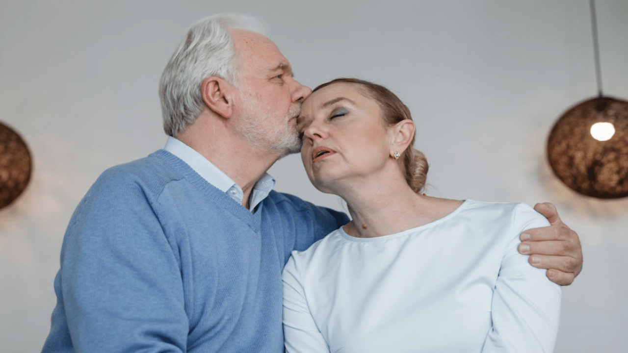 A man kissing his upset wife