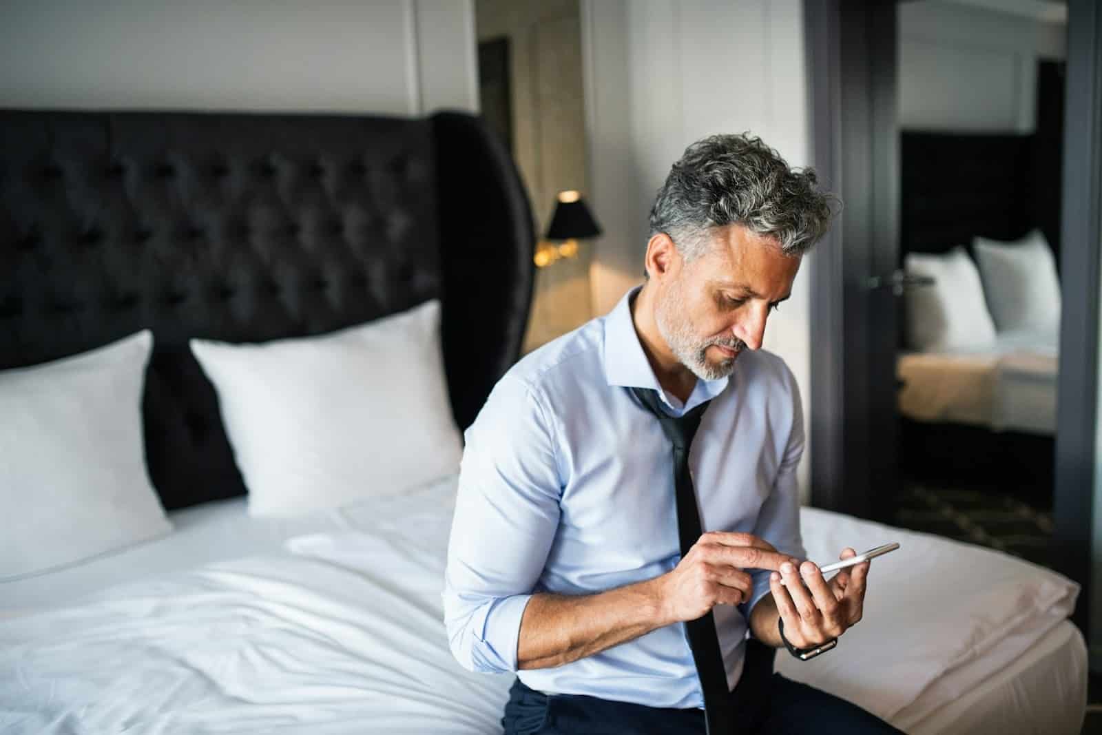 man looking at phone