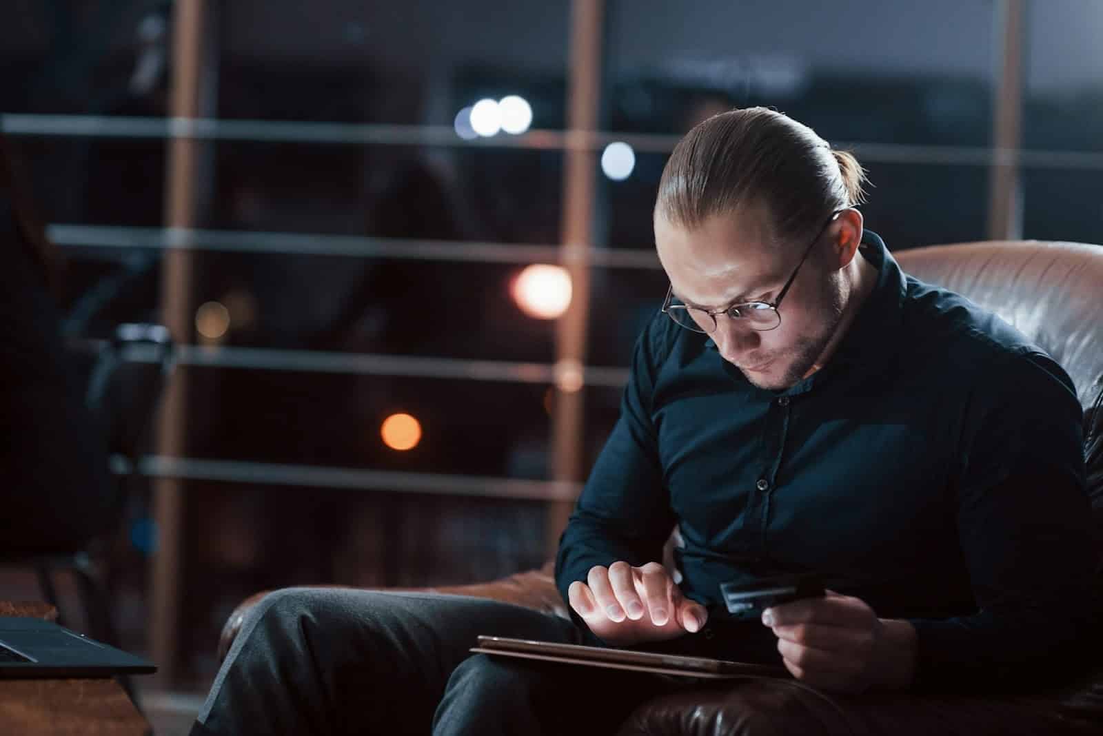 man scrolling phone night