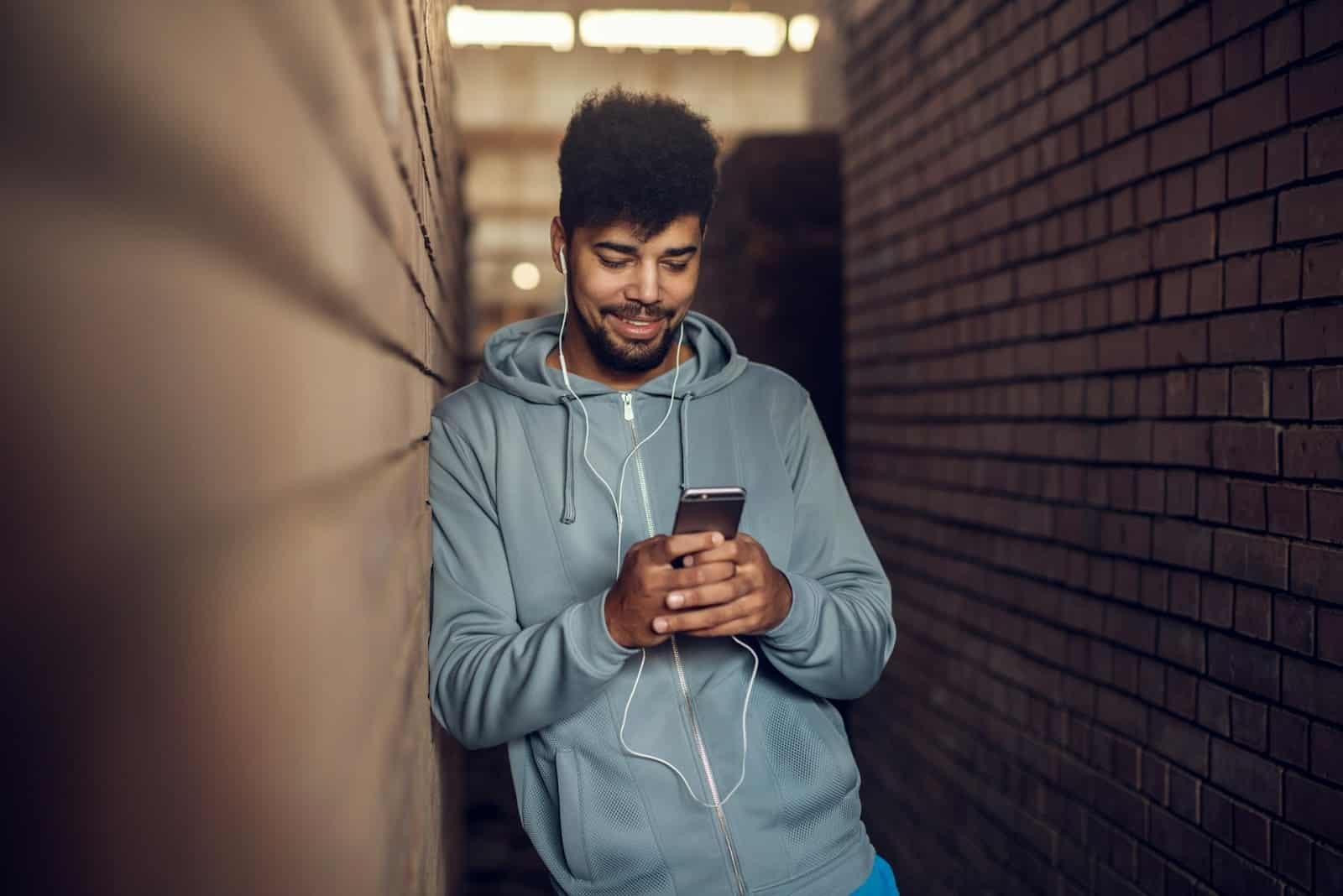 man scrolling phone